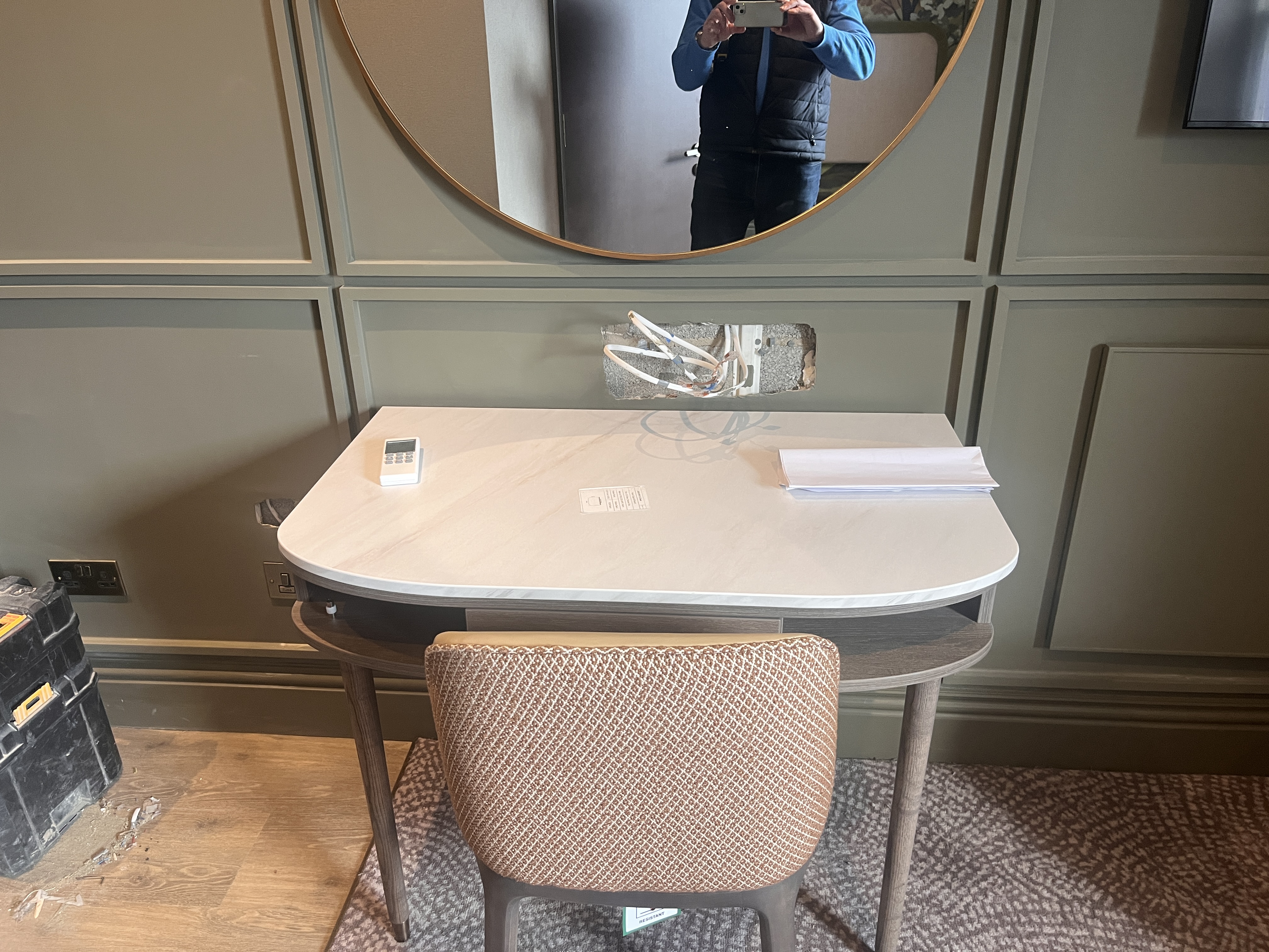 Harrogate hotel room mid-installation with toolboxes and wall panelling going up